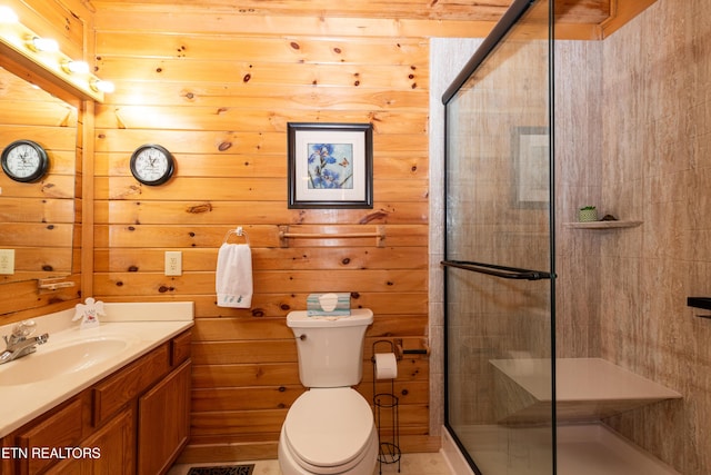 bathroom with a stall shower, vanity, and toilet