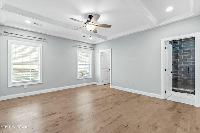 unfurnished room featuring baseboards, crown molding, light wood finished floors, and ceiling fan