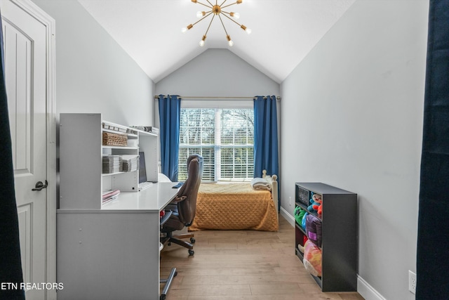 office area with lofted ceiling, a notable chandelier, baseboards, and wood finished floors