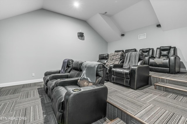 cinema with lofted ceiling, baseboards, visible vents, and carpet floors