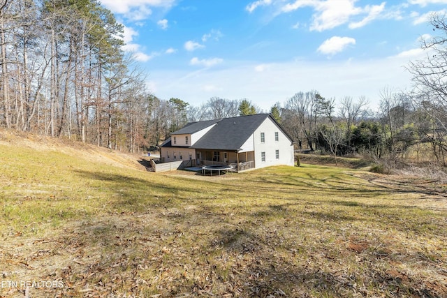 view of side of property with a yard