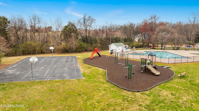 view of swimming pool with playground community, a yard, community basketball court, and fence