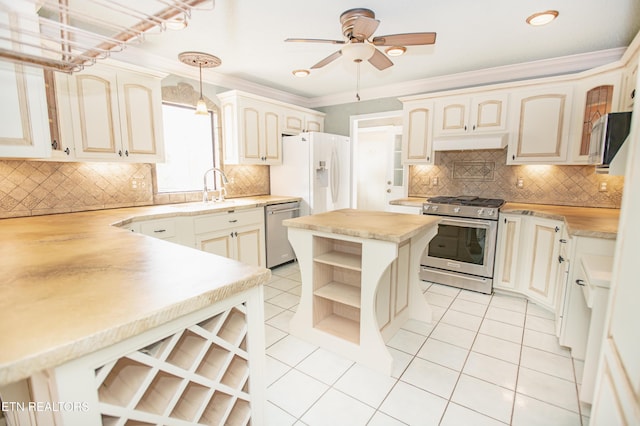 kitchen with open shelves, a sink, appliances with stainless steel finishes, light tile patterned floors, and ceiling fan