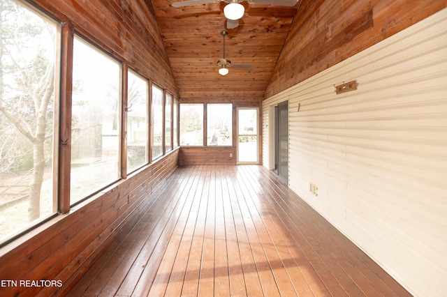 unfurnished sunroom featuring vaulted ceiling, wooden ceiling, and ceiling fan