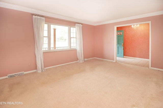 unfurnished room featuring visible vents, an inviting chandelier, crown molding, baseboards, and light colored carpet