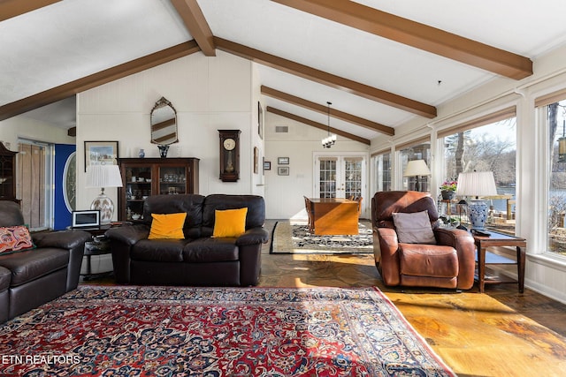 living area with lofted ceiling with beams and french doors