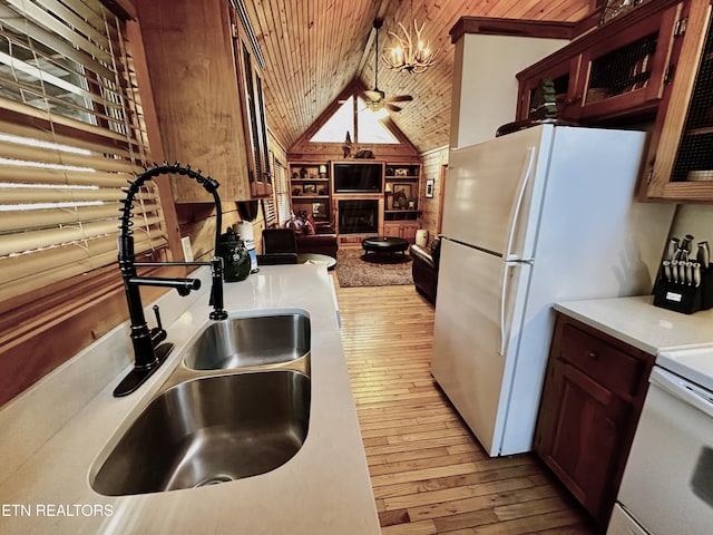 kitchen with wooden ceiling, vaulted ceiling, light countertops, glass insert cabinets, and pendant lighting