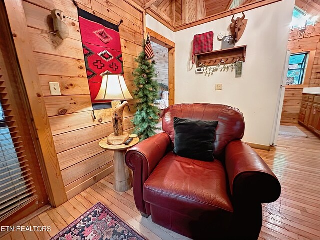 831 Bear Run Way, Sevierville, TN 37862 - sitting room with wooden walls, light wood finished floors, and baseboards