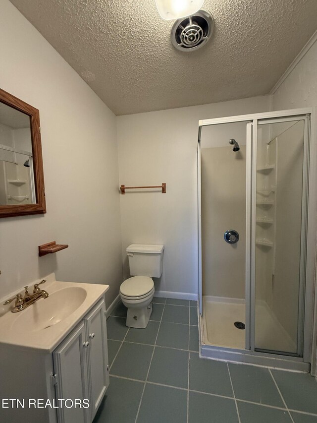 7000 Big Horn Dr Unit A-3, Crossville, TN 38572 - bathroom with visible vents, toilet, tile patterned floors, vanity, and a shower stall