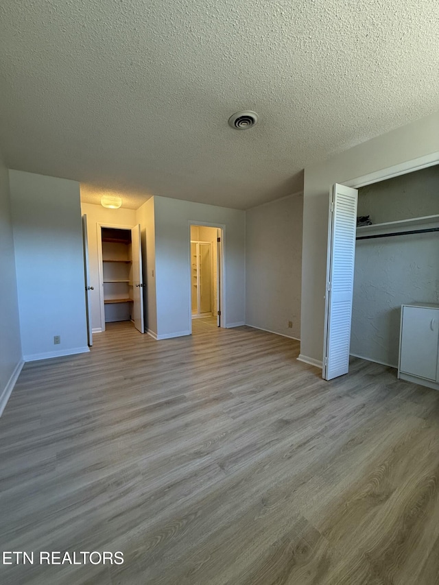 7000 Big Horn Dr Unit A-3, Crossville, TN 38572 - unfurnished bedroom with baseboards, visible vents, and wood finished floors