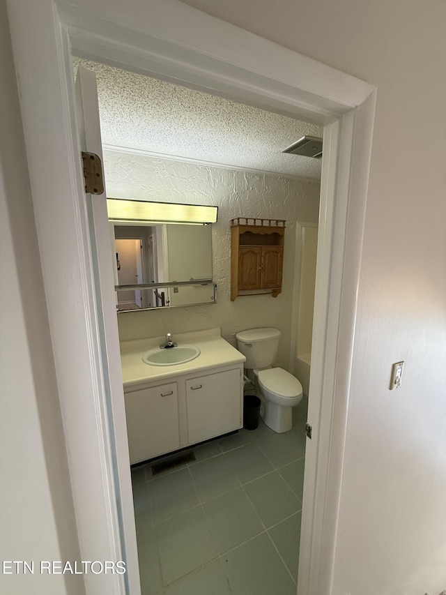 7000 Big Horn Dr Unit A-3, Crossville, TN 38572 - full bathroom featuring toilet, tile patterned flooring, visible vents, and vanity