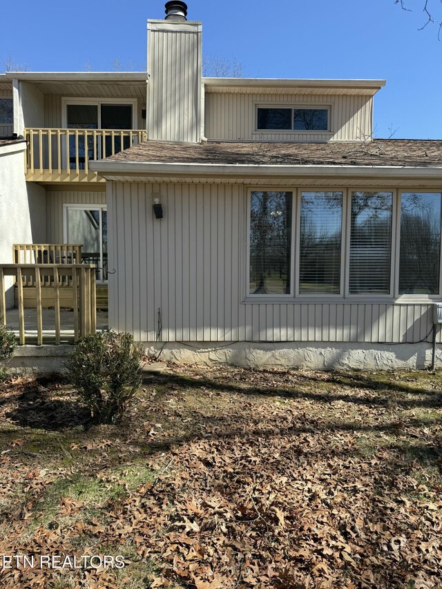7000 Big Horn Dr Unit A-3, Crossville, TN 38572 - rear view of property featuring roof with shingles, a chimney, and a balcony