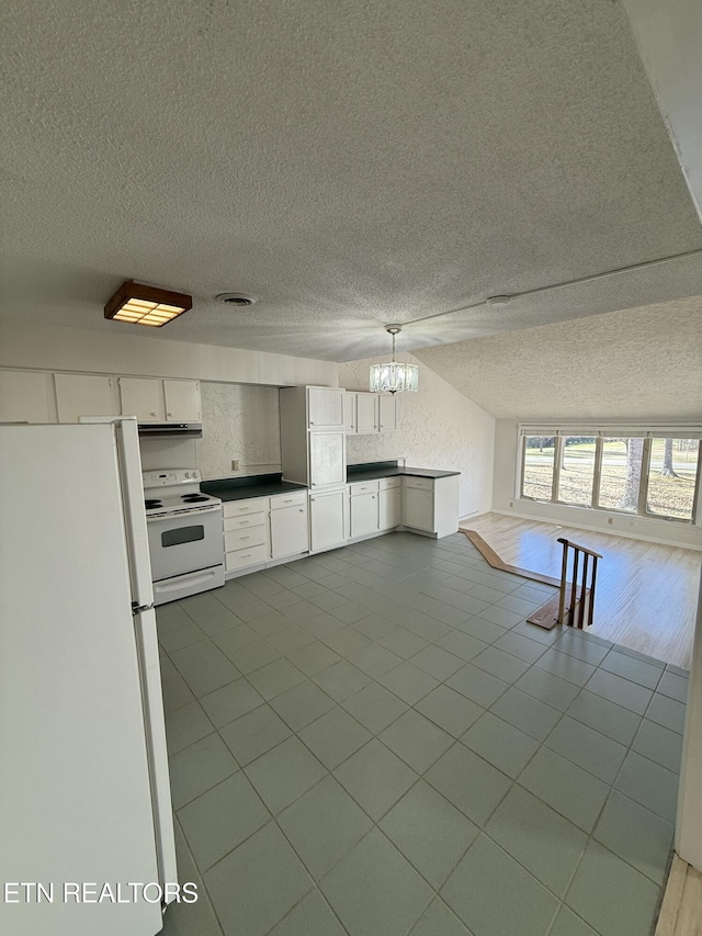7000 Big Horn Dr Unit A-3, Crossville, TN 38572 - kitchen featuring white appliances, visible vents, open floor plan, a textured ceiling, and under cabinet range hood