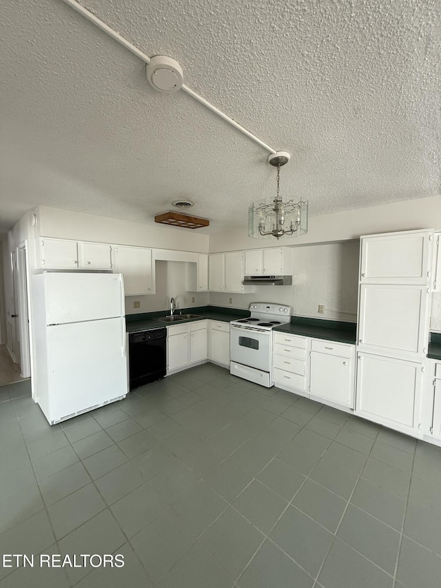 7000 Big Horn Dr Unit A-3, Crossville, TN 38572 - kitchen with dark countertops, white appliances, white cabinetry, and a sink