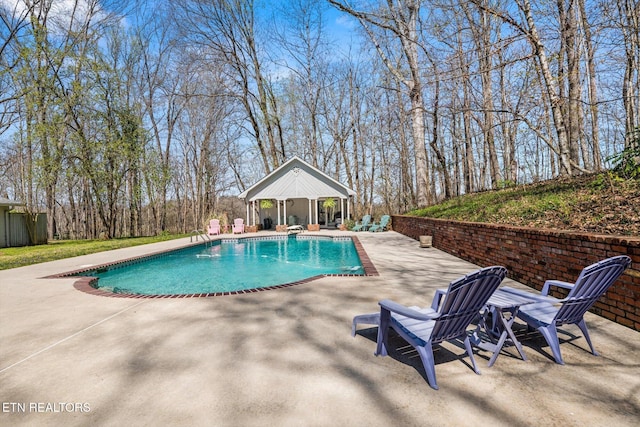 view of swimming pool featuring a gazebo, a fenced in pool, and a patio