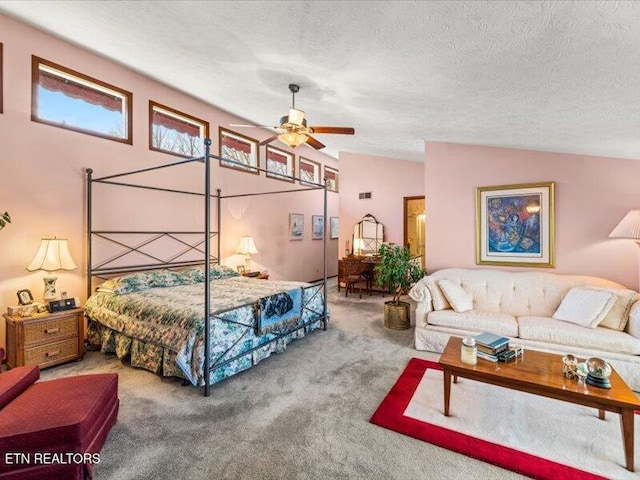 bedroom with carpet floors, a textured ceiling, and vaulted ceiling