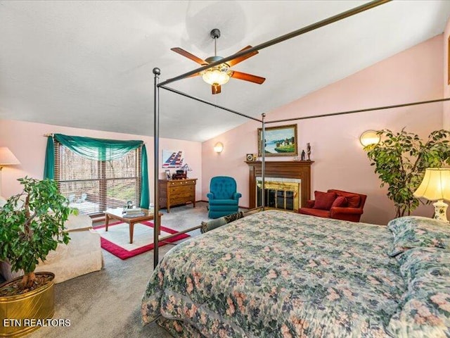 bedroom with carpet flooring and vaulted ceiling