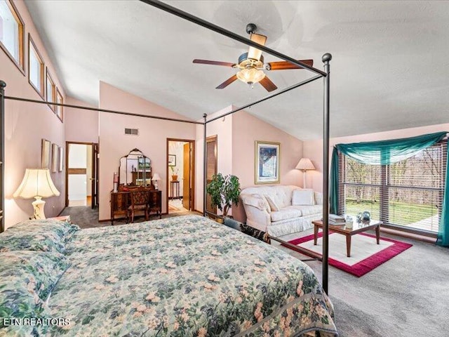 carpeted bedroom featuring visible vents, multiple windows, and lofted ceiling