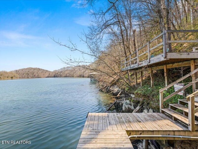 view of dock with a water view