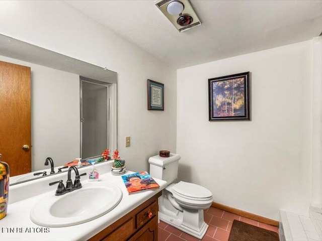 full bathroom featuring vanity, toilet, baseboards, and tile patterned flooring