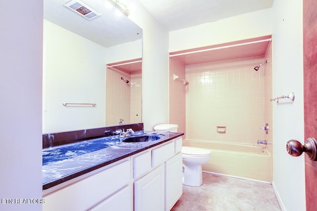 bathroom with shower / bathtub combination, visible vents, toilet, vanity, and tile patterned flooring