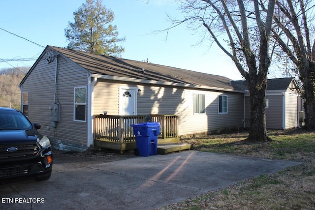 view of front of home with a wooden deck