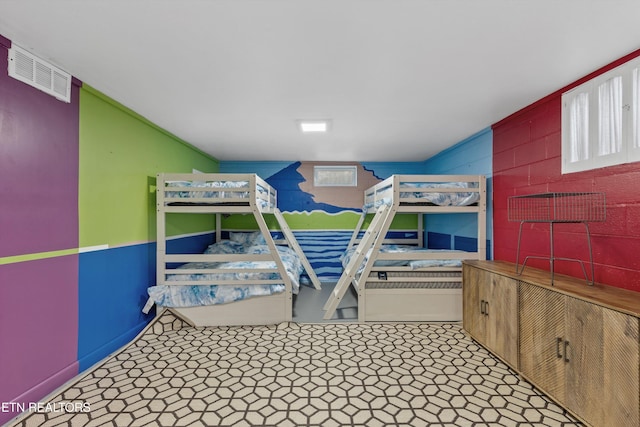 bedroom with visible vents and tile patterned floors