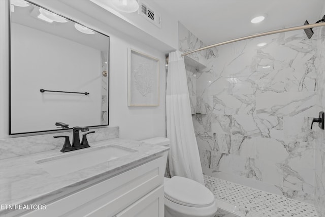 full bath featuring toilet, a stall shower, visible vents, and vanity