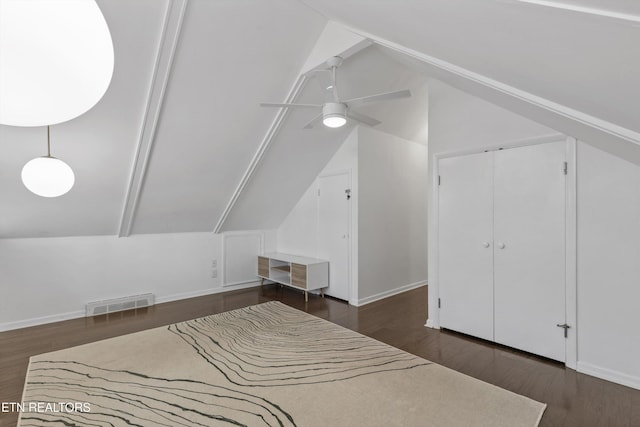 bonus room featuring baseboards, visible vents, lofted ceiling, ceiling fan, and wood finished floors