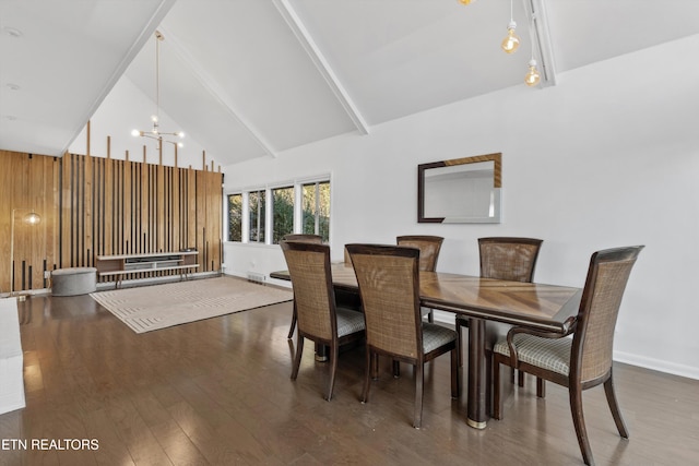 dining space with high vaulted ceiling, wooden walls, wood finished floors, visible vents, and an inviting chandelier