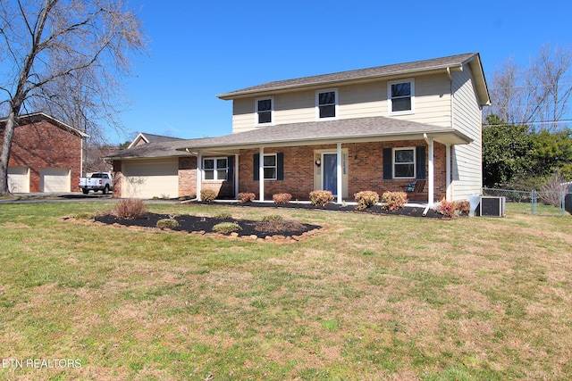 traditional-style house with covered porch, fence, a front lawn, central AC, and brick siding