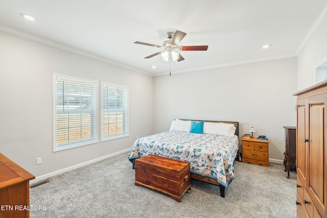 carpeted bedroom with visible vents, crown molding, and baseboards