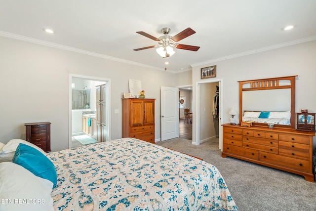 carpeted bedroom with connected bathroom, crown molding, and recessed lighting