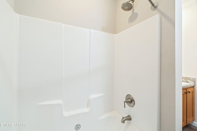 details with bathtub / shower combination and vanity