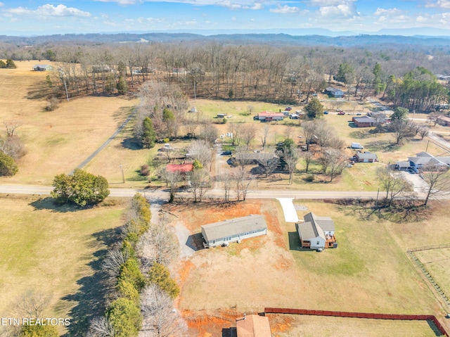 birds eye view of property with a rural view and a view of trees