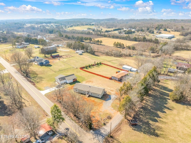 birds eye view of property with a rural view