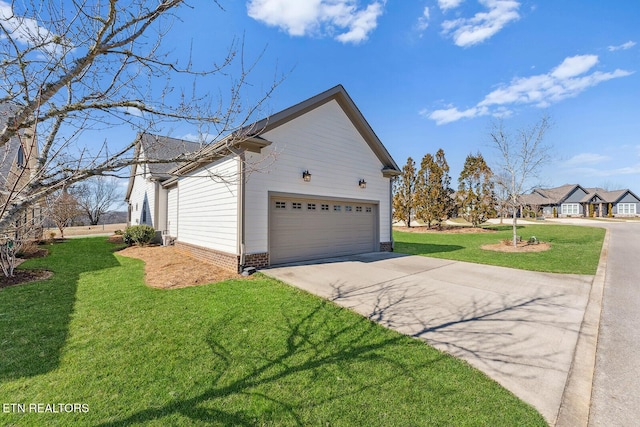 view of property exterior featuring an attached garage, a yard, and concrete driveway