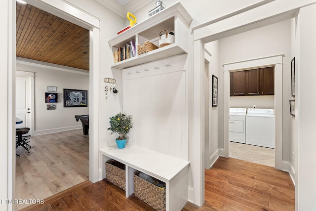 mudroom featuring wood ceiling, washing machine and dryer, ornamental molding, and light wood-style flooring