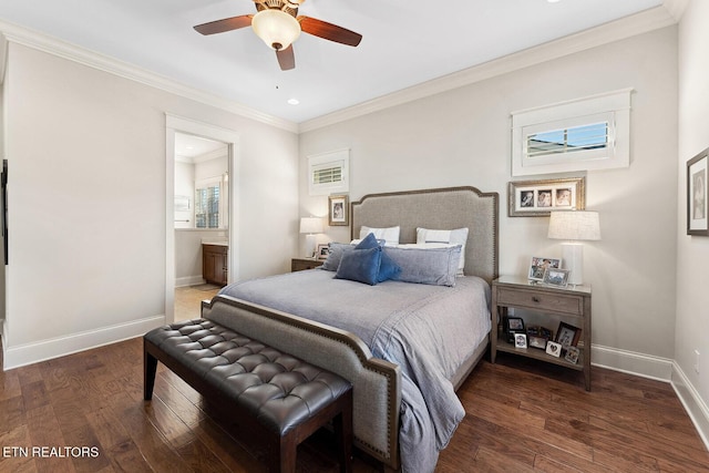 bedroom with dark wood-type flooring, connected bathroom, crown molding, and baseboards