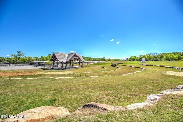 view of home's community with a yard and a gazebo