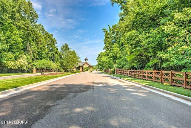 view of road featuring curbs