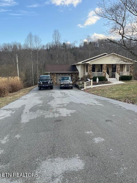 view of road with aphalt driveway