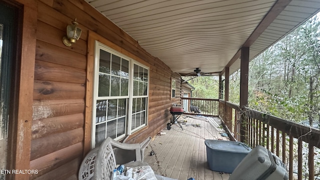 deck with ceiling fan and a porch