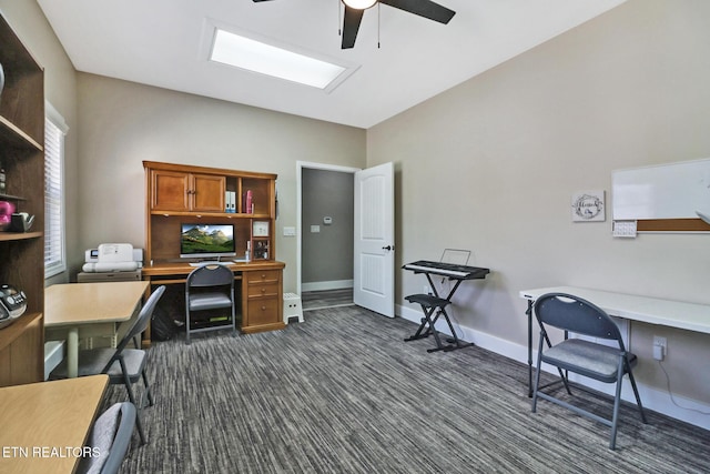 home office featuring ceiling fan, dark carpet, and baseboards