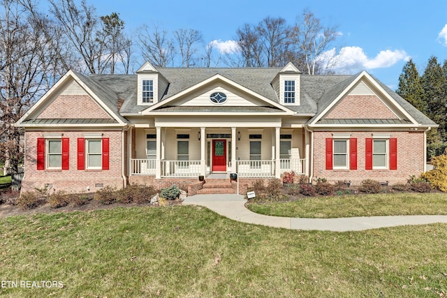 view of front of home with brick siding, covered porch, crawl space, a standing seam roof, and a front lawn