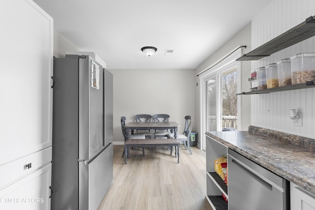 kitchen featuring open shelves, light wood-style flooring, visible vents, and appliances with stainless steel finishes