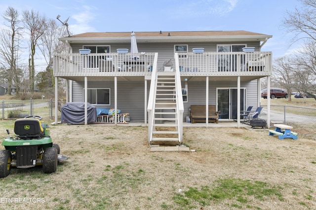 rear view of house featuring a gate, a deck, stairs, and fence