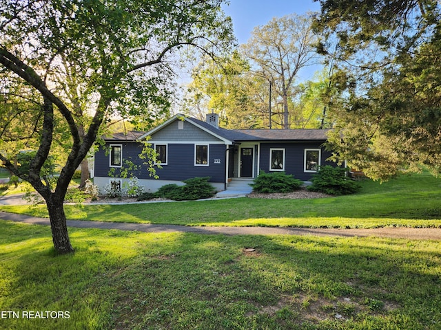 132 Pine Rd, Norris, TN 37828 - ranch-style home with a chimney and a front lawn