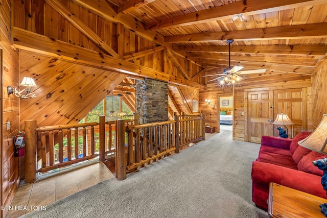 living area with wood ceiling, carpet flooring, wooden walls, and lofted ceiling with beams