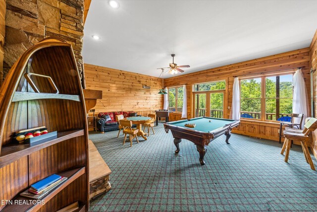 rec room featuring carpet floors, wood walls, and billiards